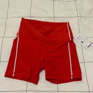 NWT Athleta 5” Biker Short in Red with Silver Accents Size M